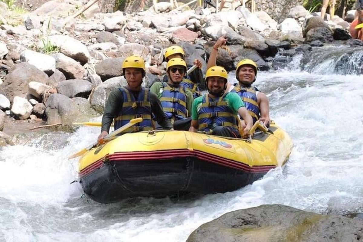 a group of men in helmets on a raft in a river