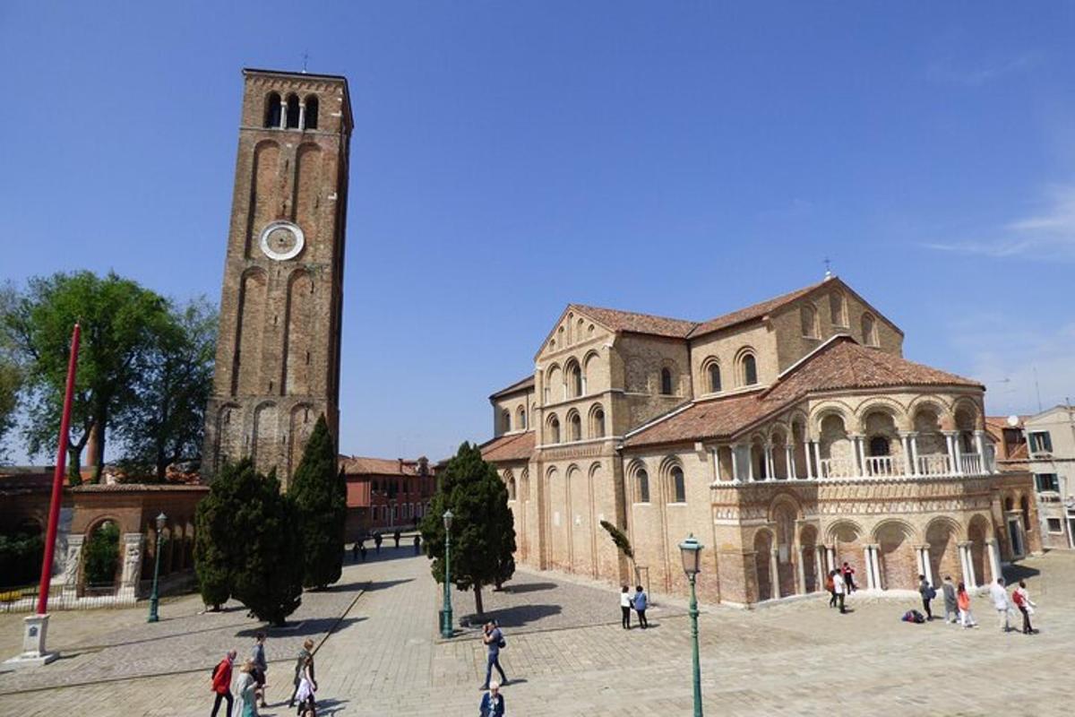 a large building with a clock tower in front of it