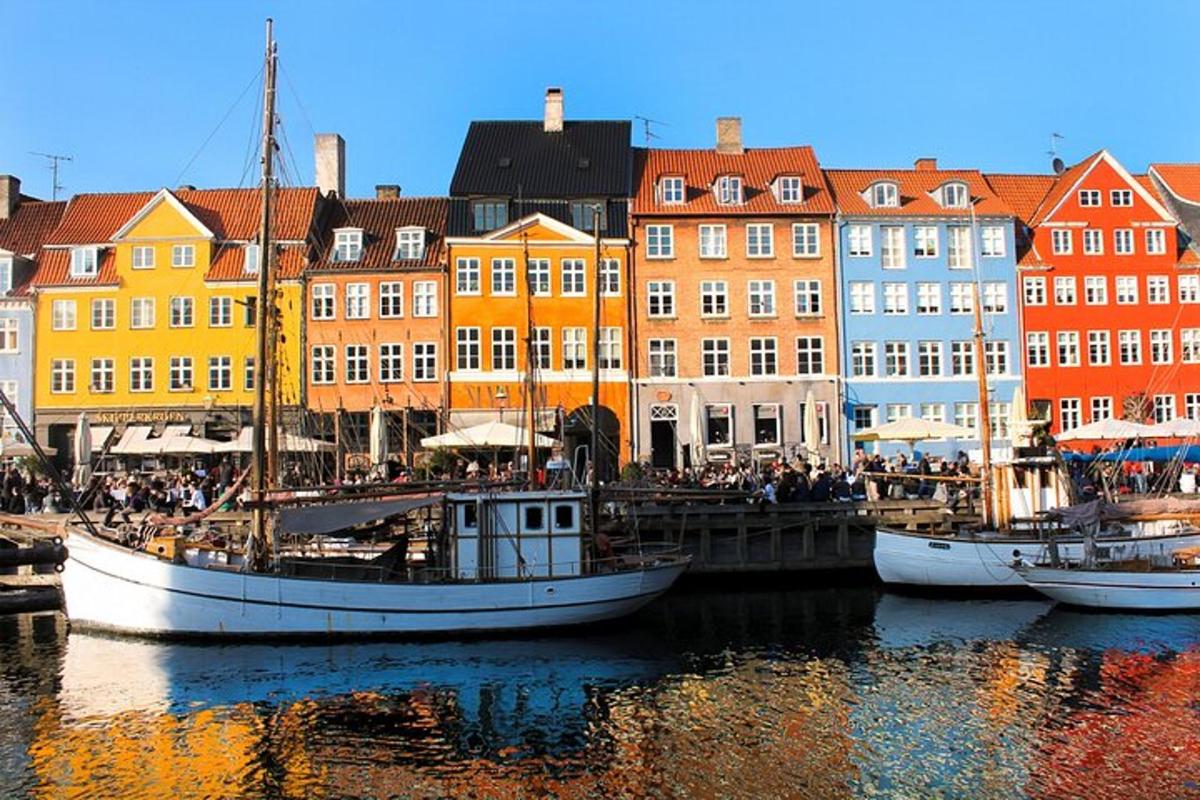 a group of boats docked in a harbor with buildings