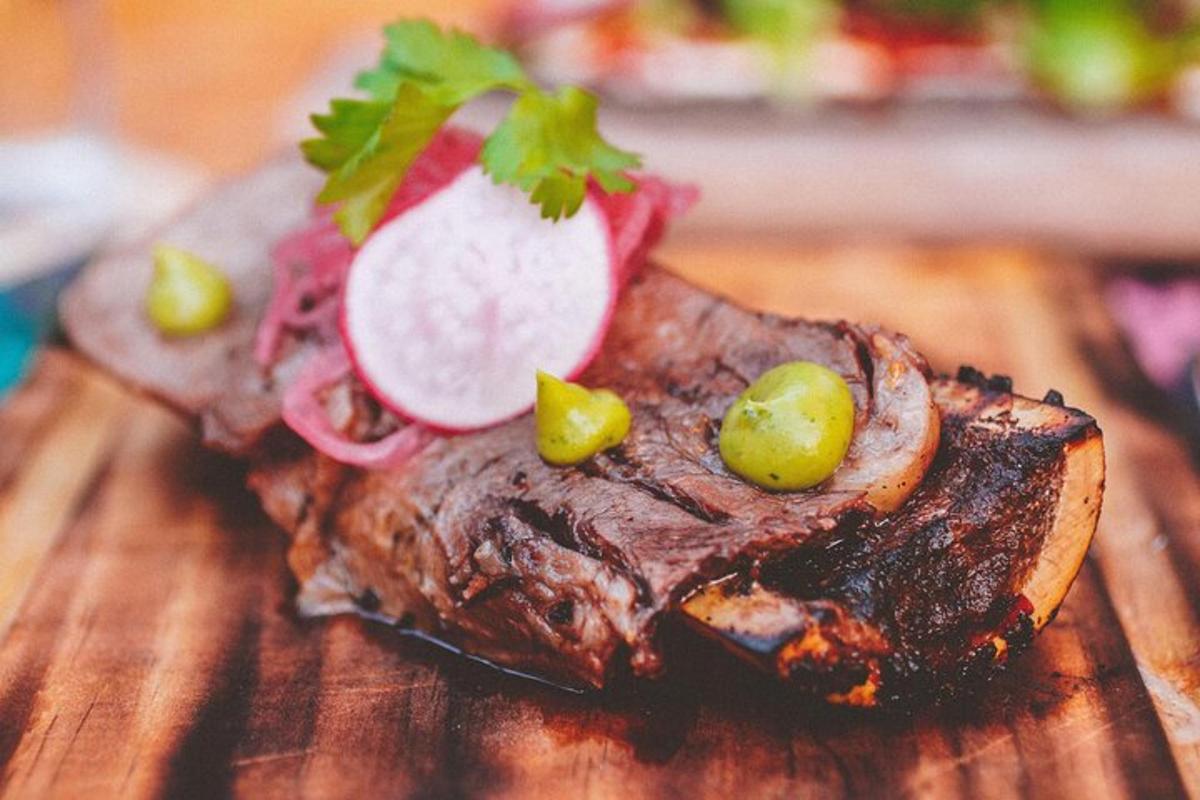 a piece of meat with vegetables on a wooden table