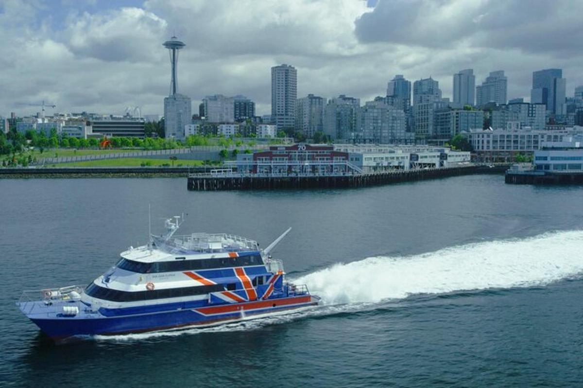 a boat in the water with a city in the background
