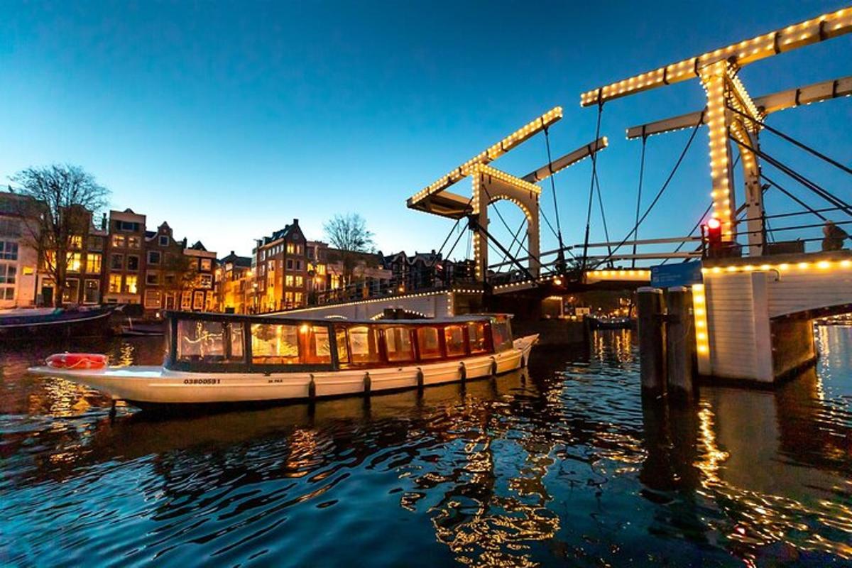 a boat in the water next to a bridge
