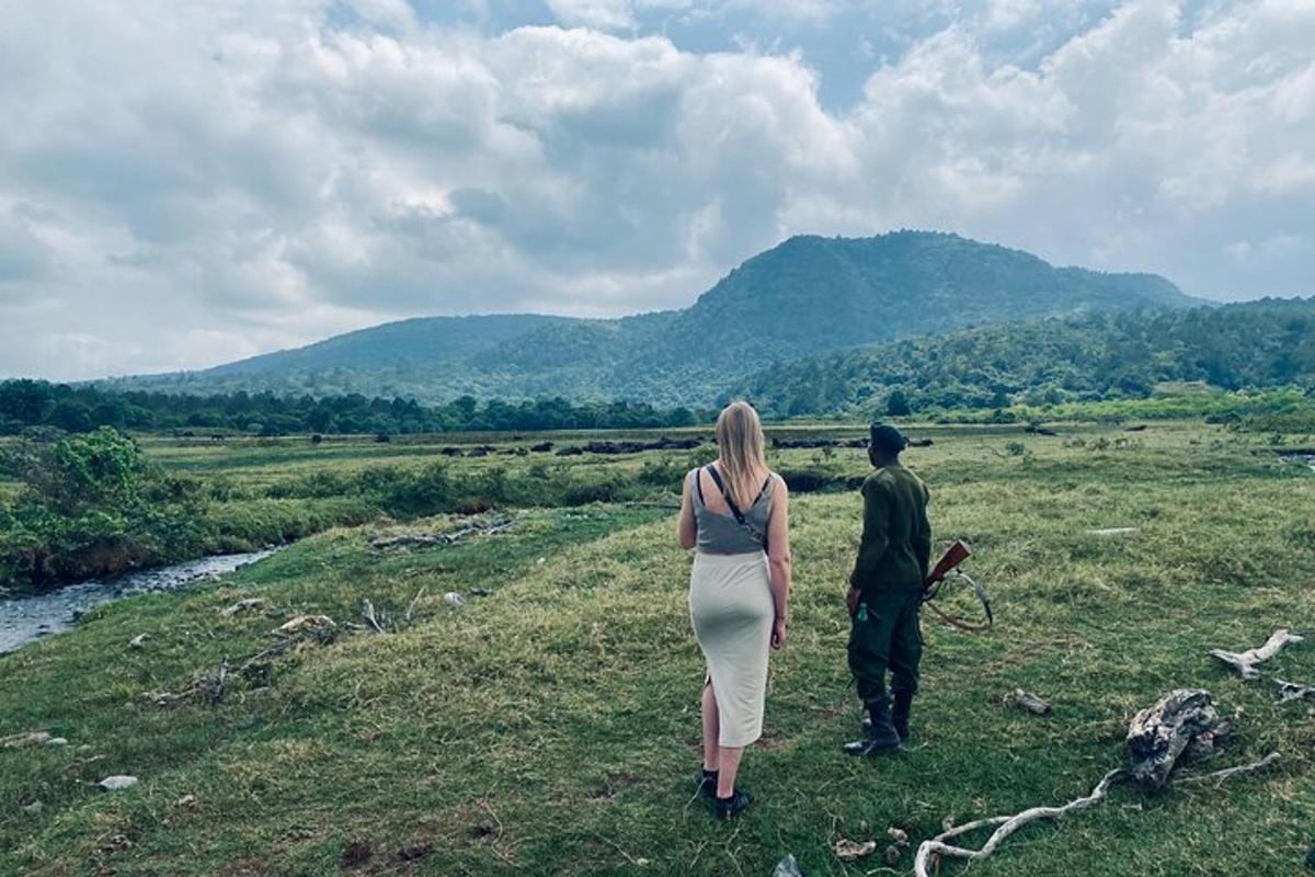 a man and a woman walking in a field
