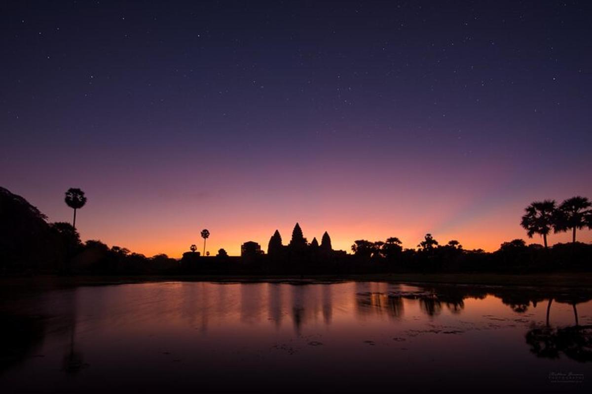 a view of a temple at night with the sky