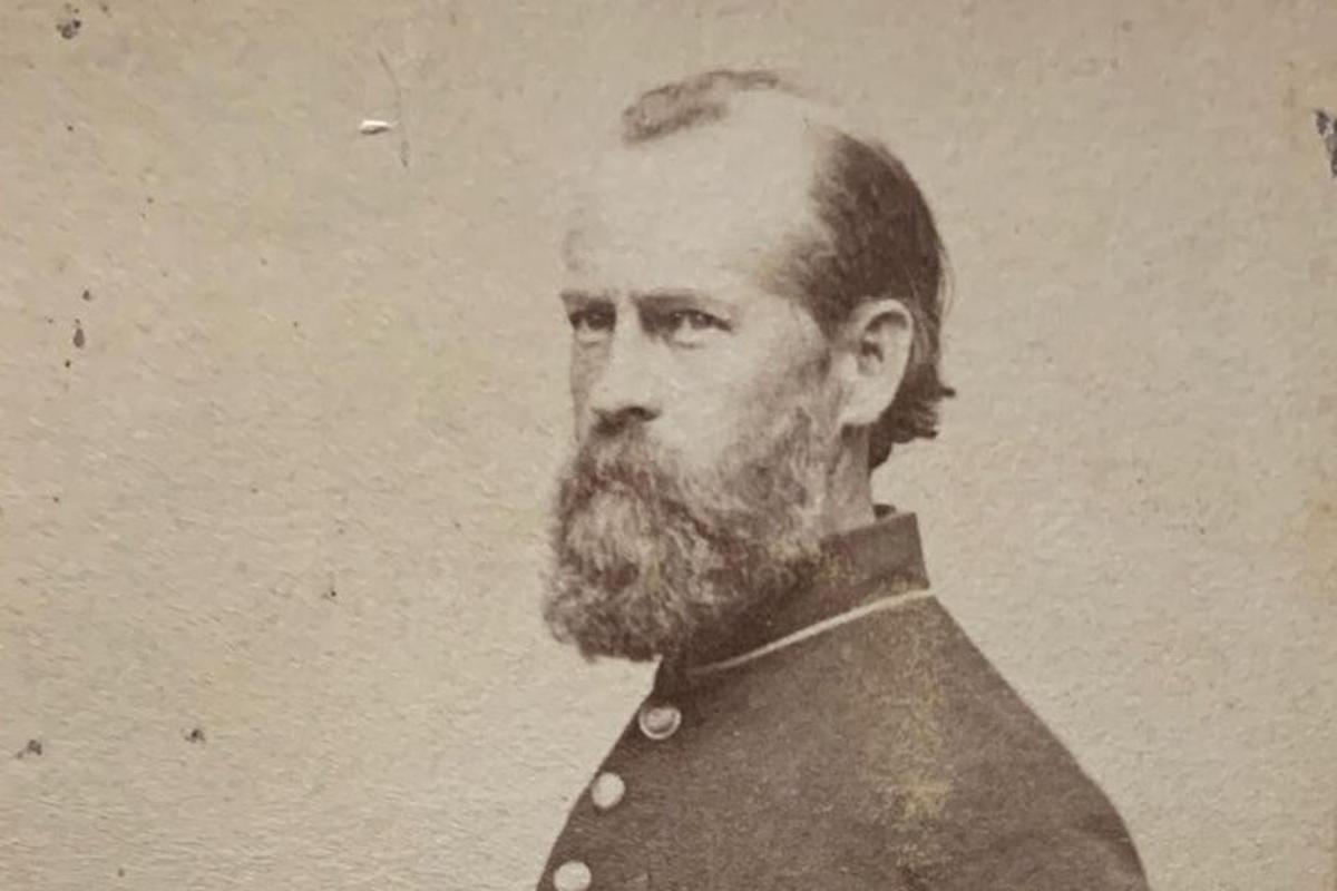 a black and white photo of a man with a beard