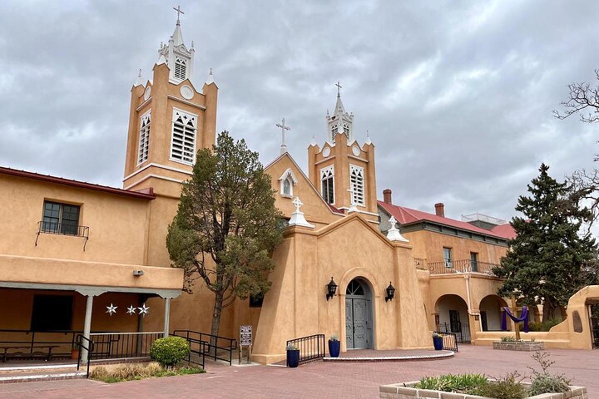 a church with two towers and a clock tower
