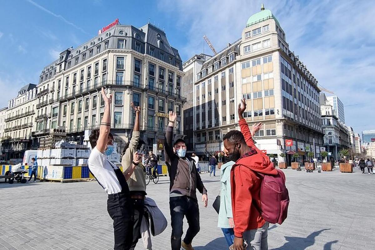 a group of people with their hands in the air