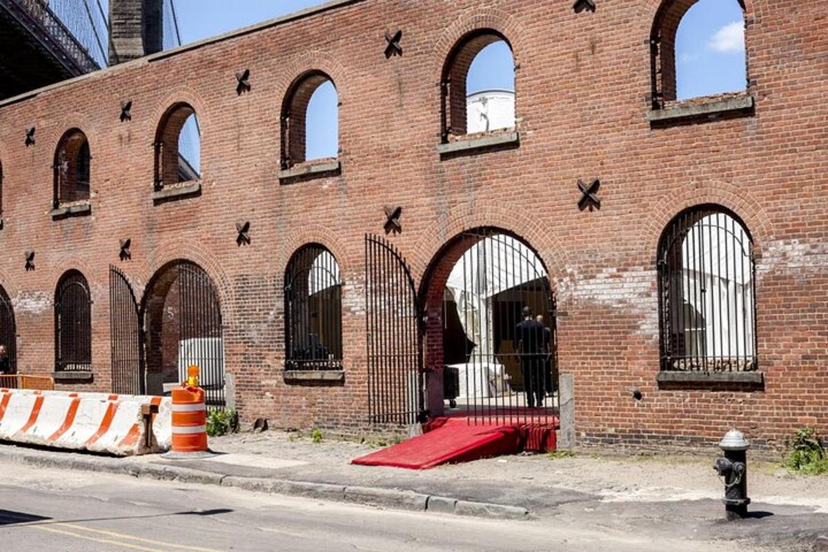 a brick building with arches on the side of it