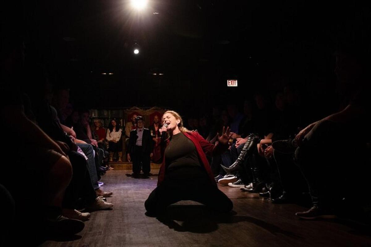 a woman walking down a runway in front of a crowd