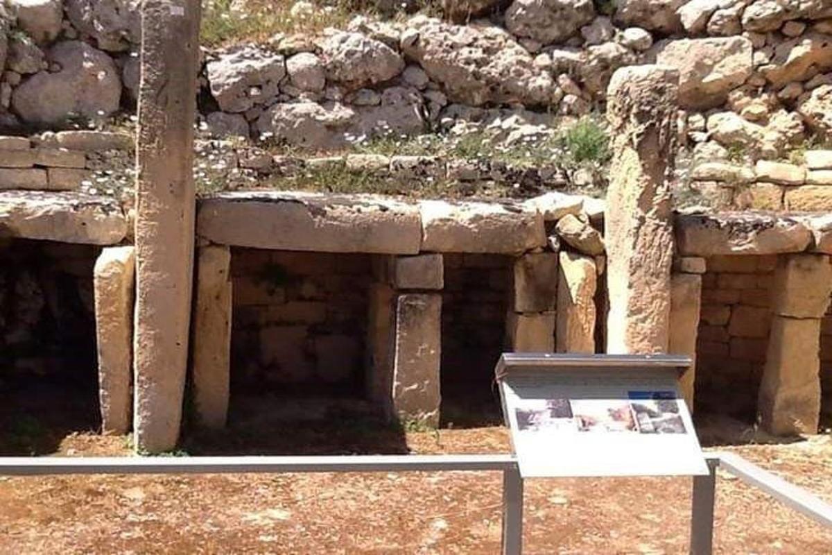 a exhibit in front of a stone building