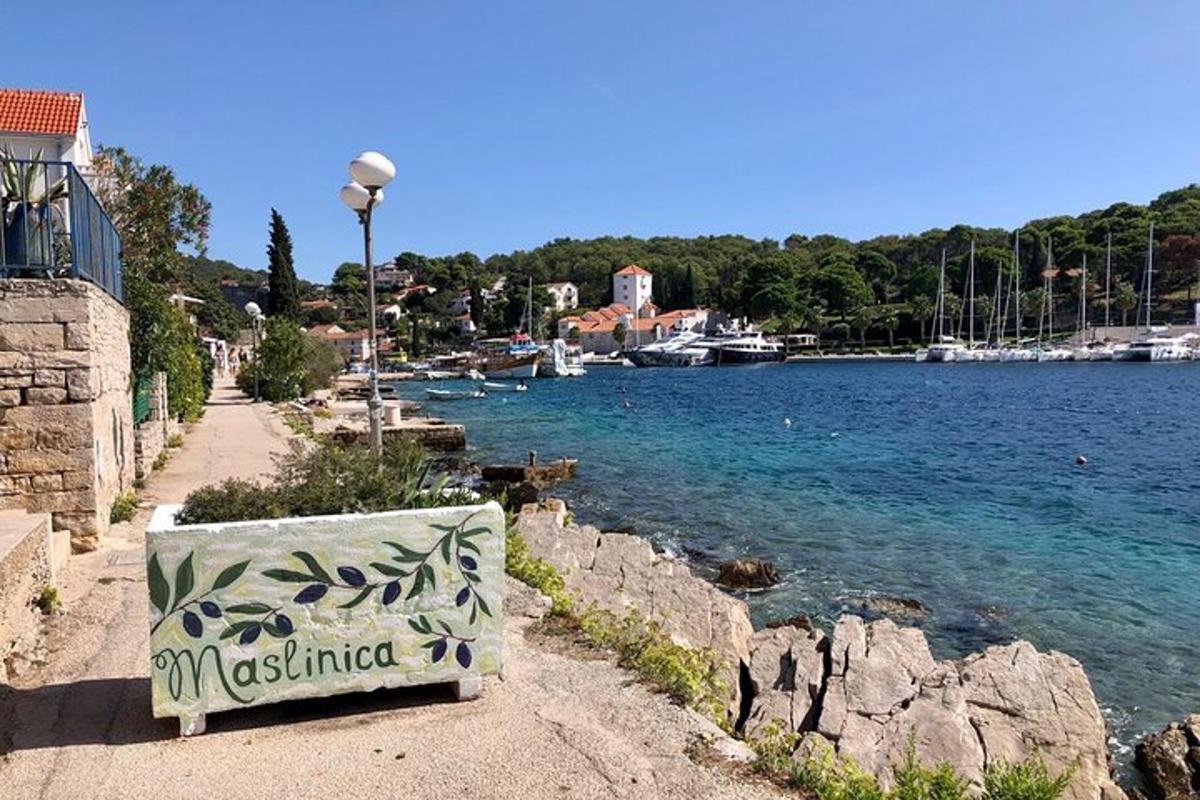 a bench sitting on the side of a body of water