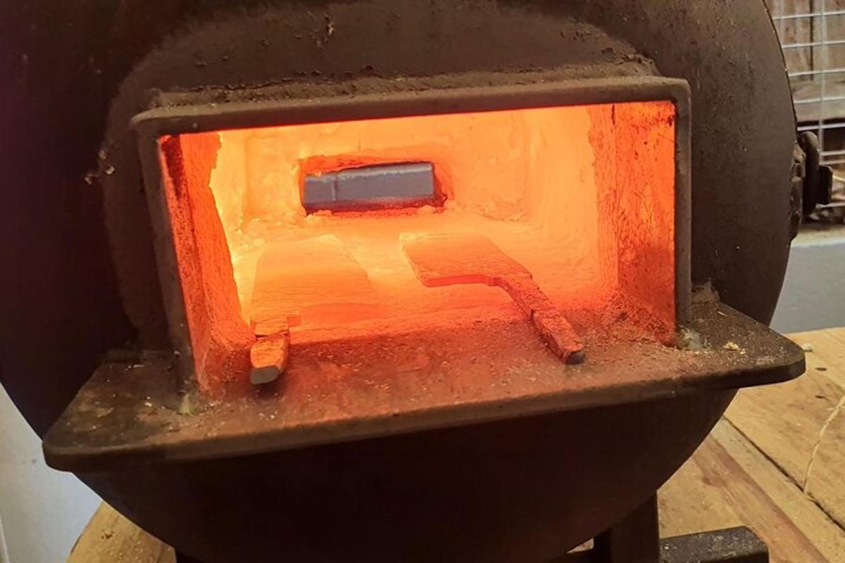 a stove with an orange object inside of it