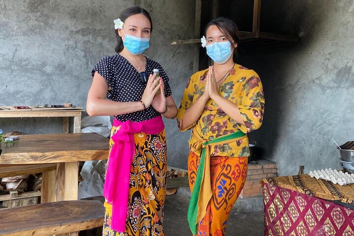 two women standing next to each other wearing masks