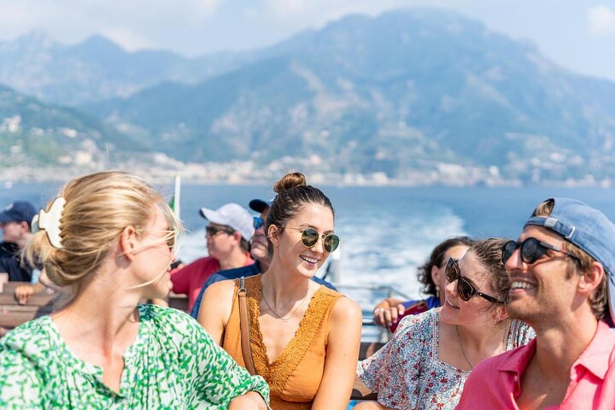 a group of people on a boat in the water