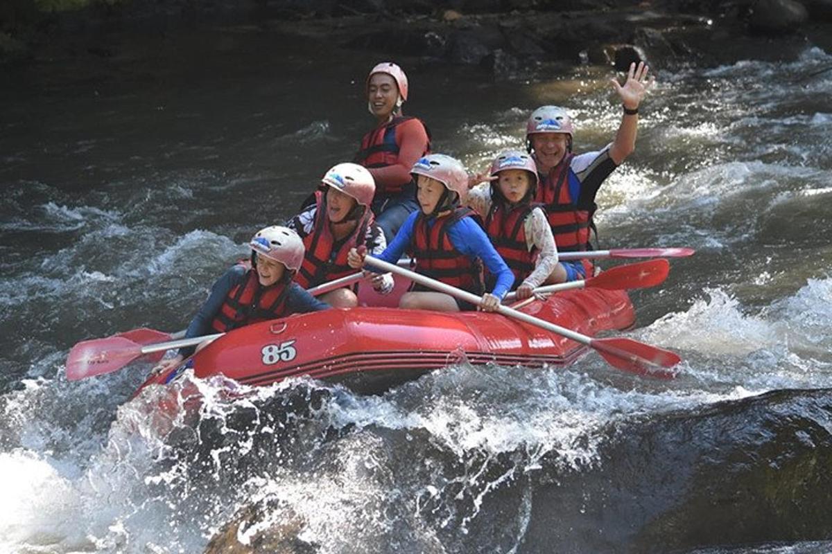 a group of people in a raft on a river