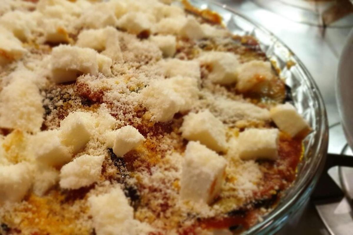 a close up of a dish of food with cheese
