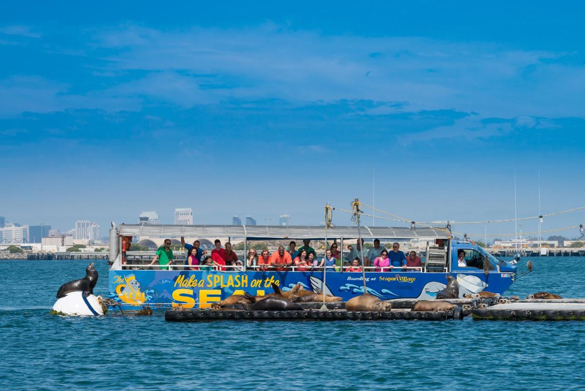 a blue boat with people on it in the water