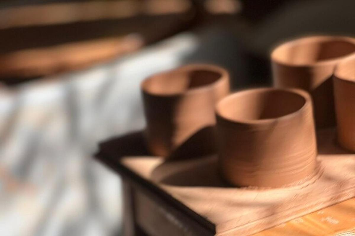 a group of brown cups sitting on a table