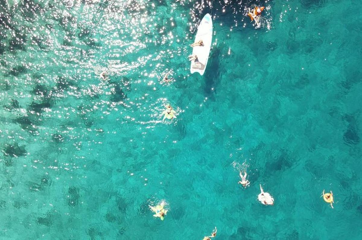 a group of people on a boat in the water