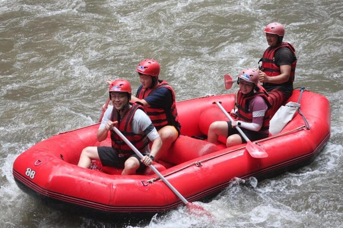 a group of people in a raft in the water