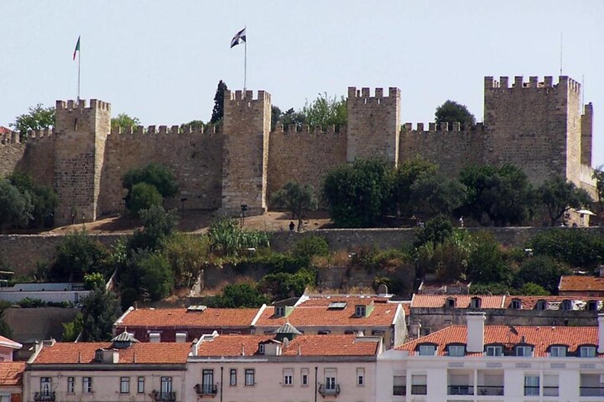 a large castle with a bunch of buildings in front