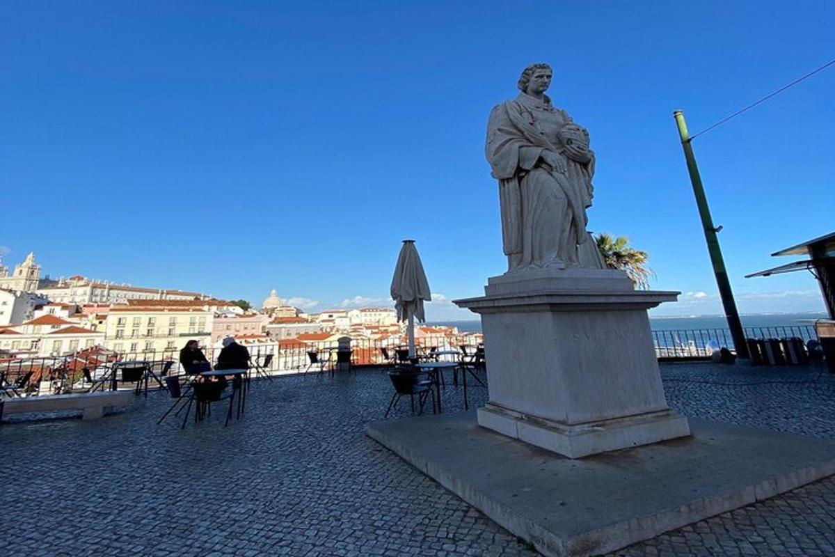 a statue of a man on a pedestal in a city
