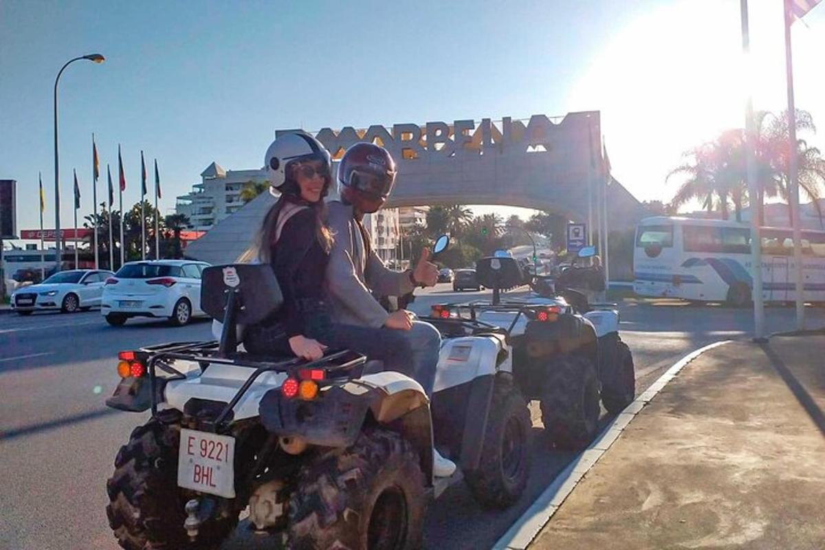 a man and a woman riding on a quad bike