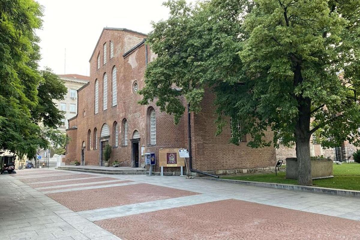 a brick building with a tree in front of it