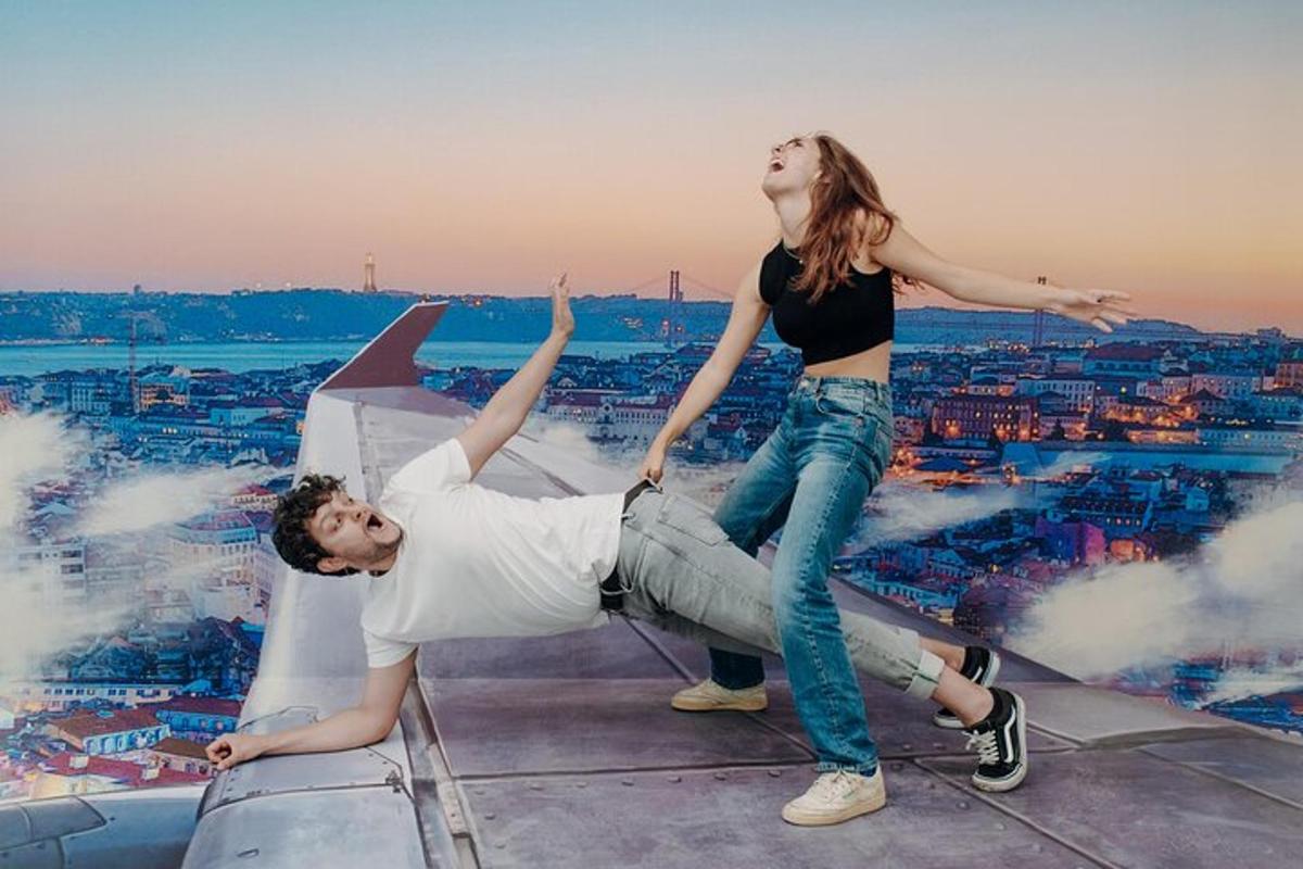 a man and a woman standing on top of an airplane