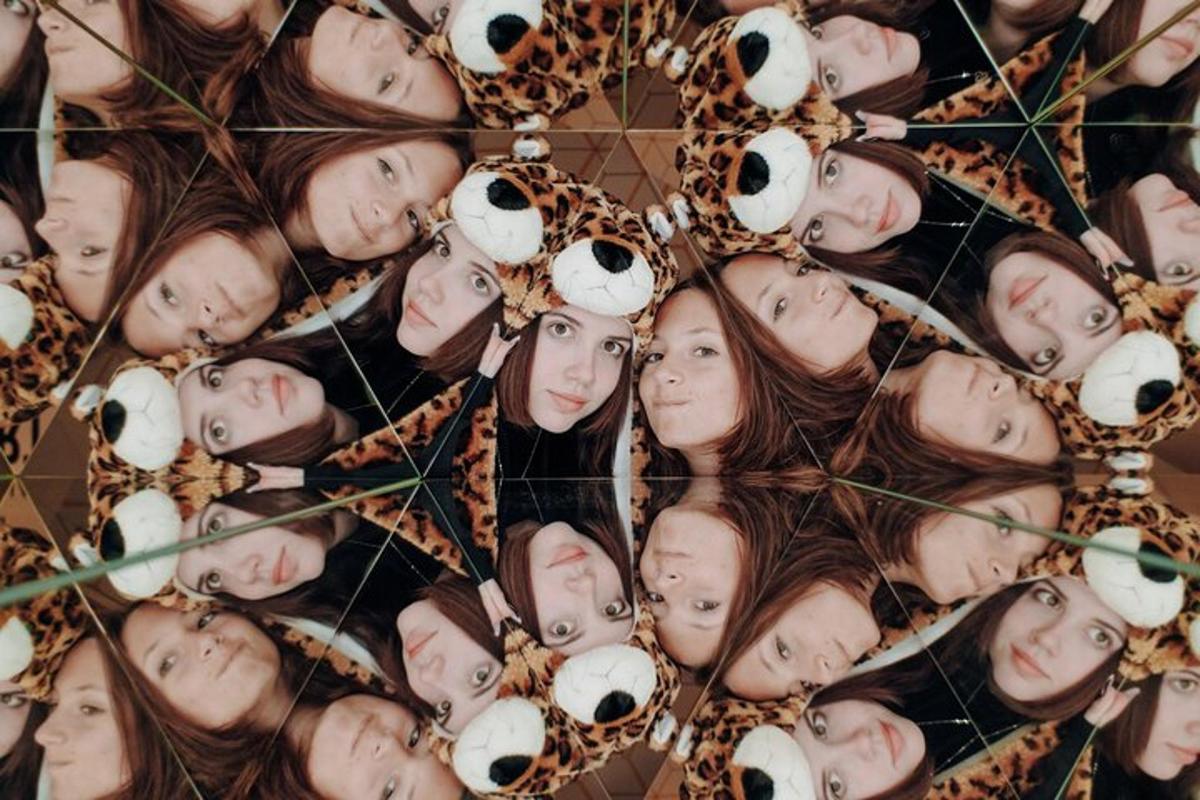 a group of young girls with their faces on a display