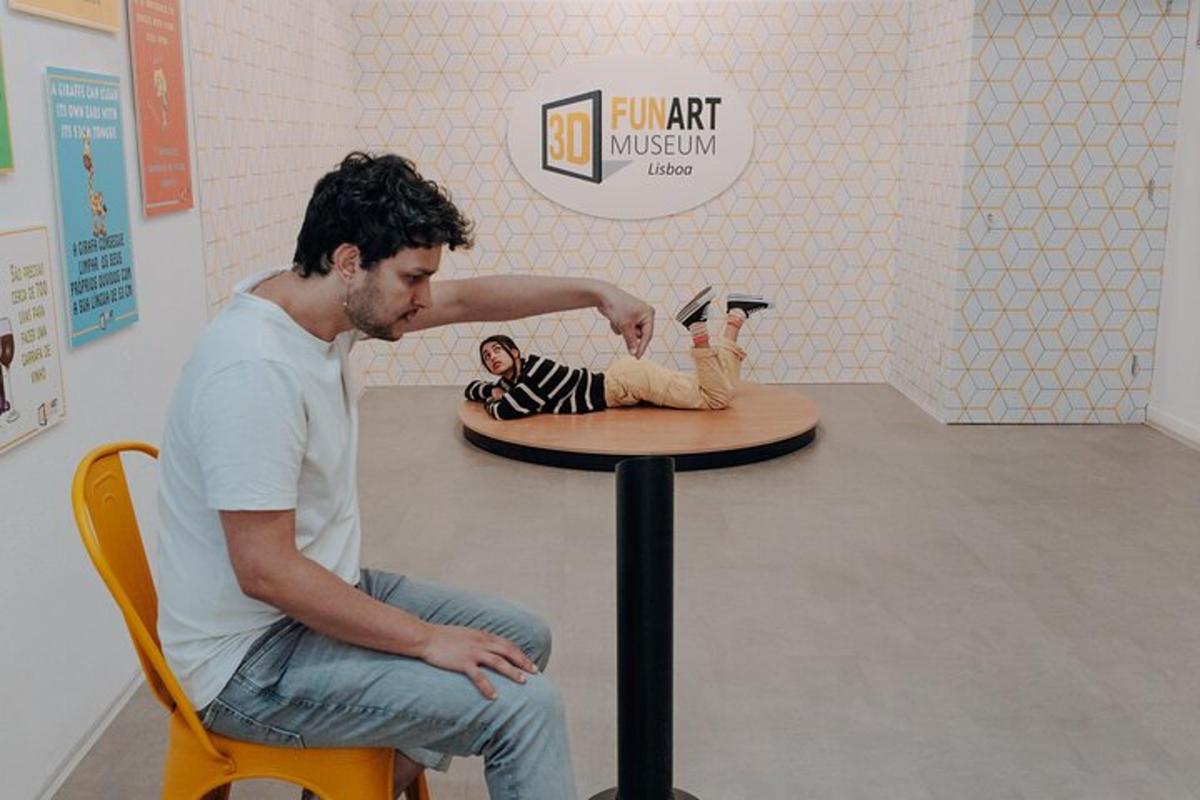 a man sitting next to a table with a doll on it