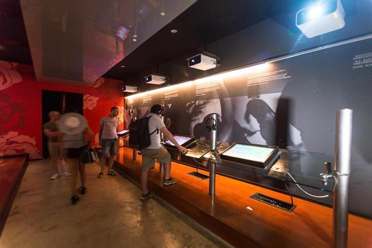 a group of people walking around a museum exhibit