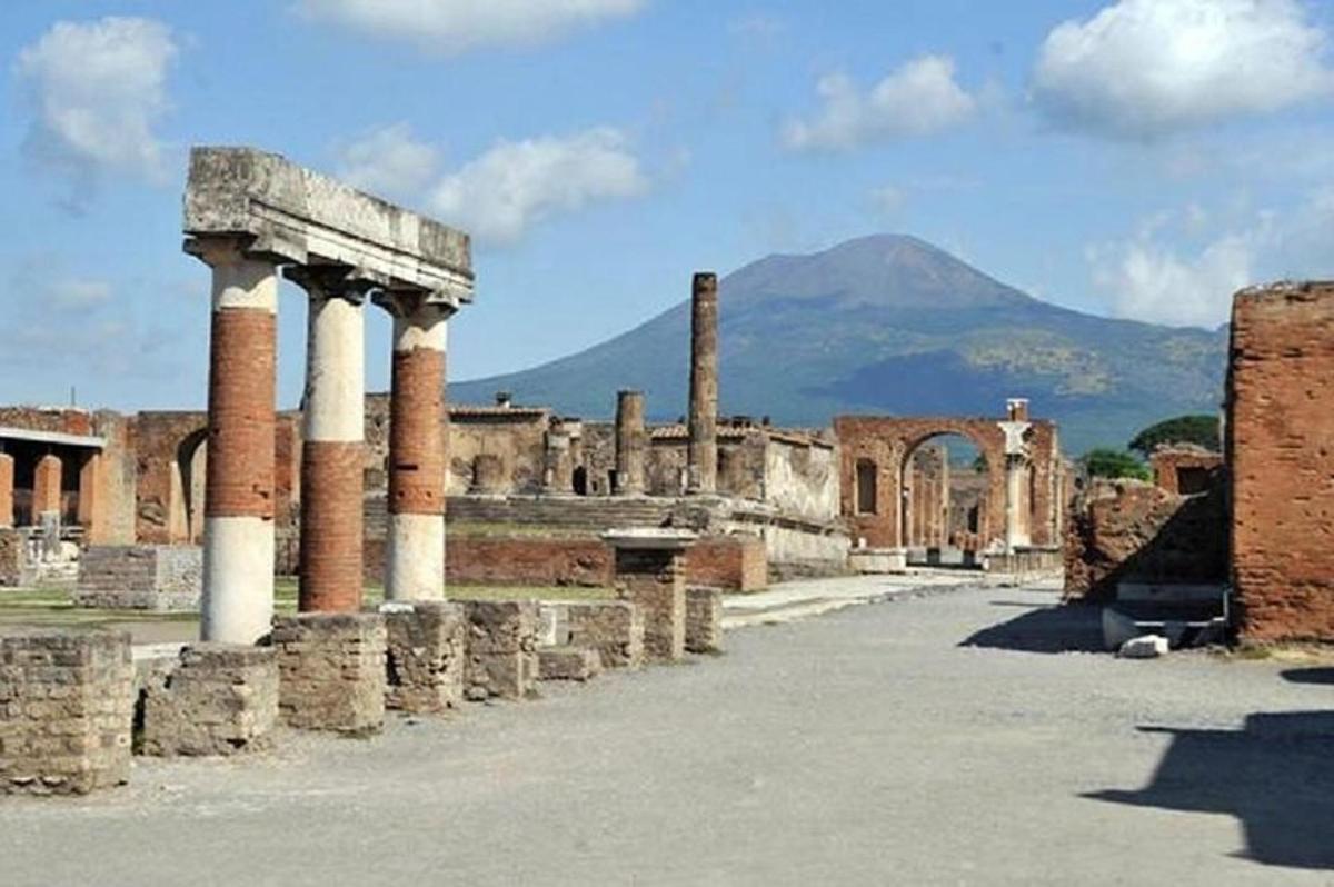 ancient ruins with a mountain in the background