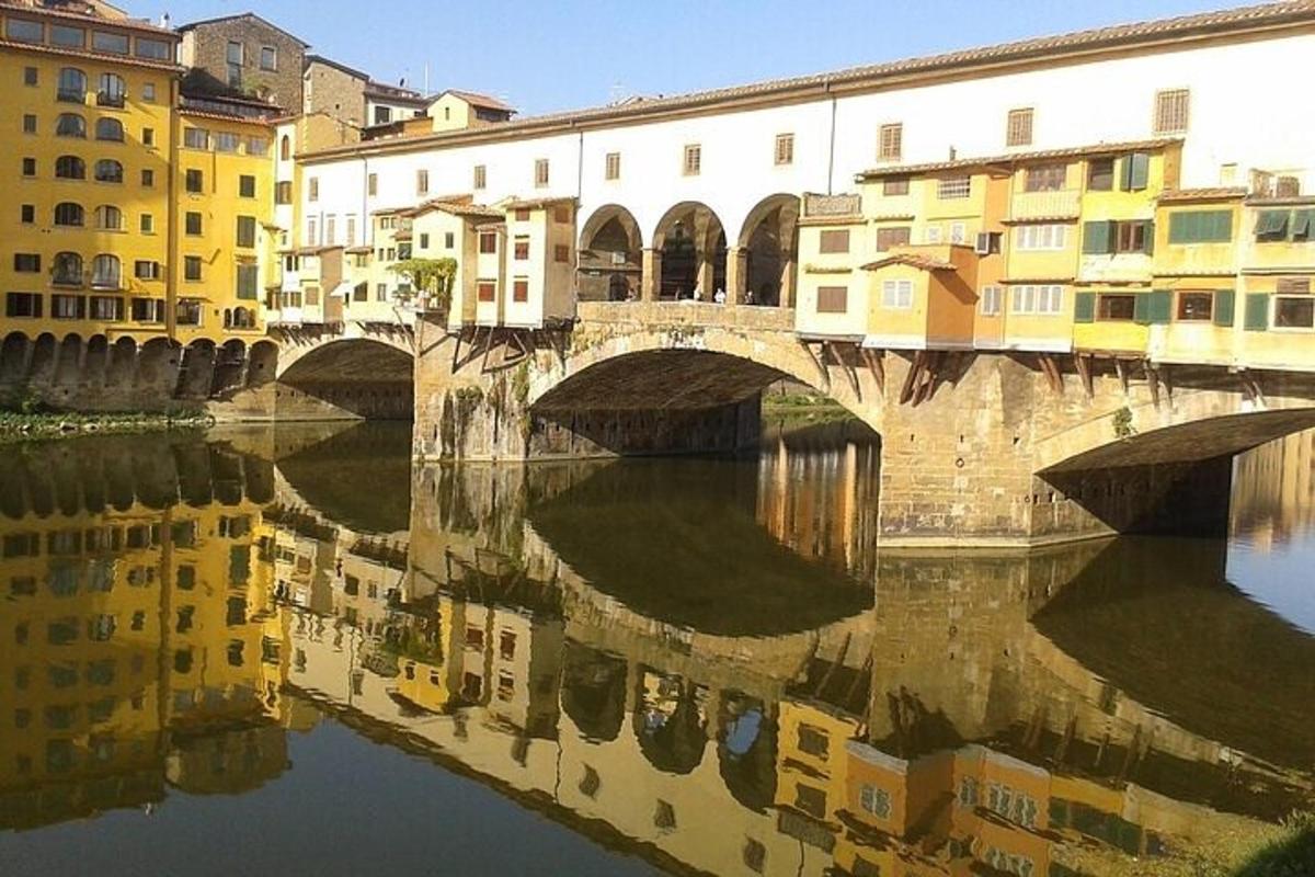 a bridge over a river in a city with buildings