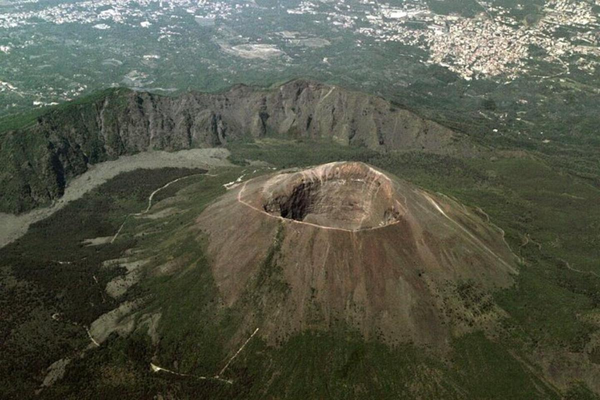 an aerial view of a mountain with a crater