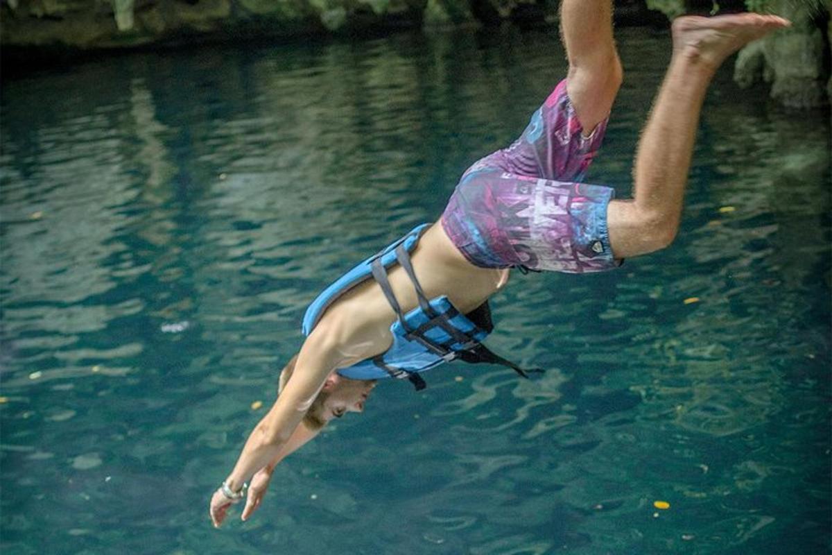 a person is jumping into the water