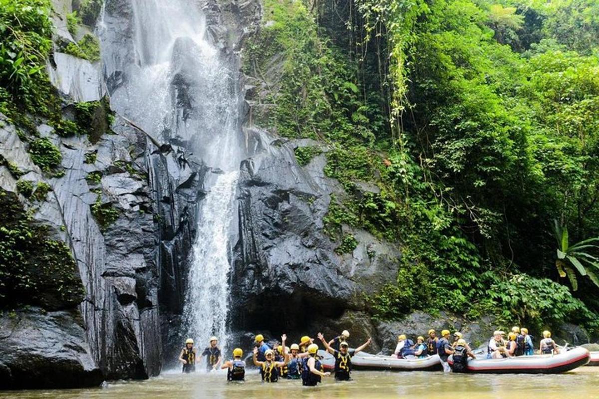 a group of people rafting down a waterfall