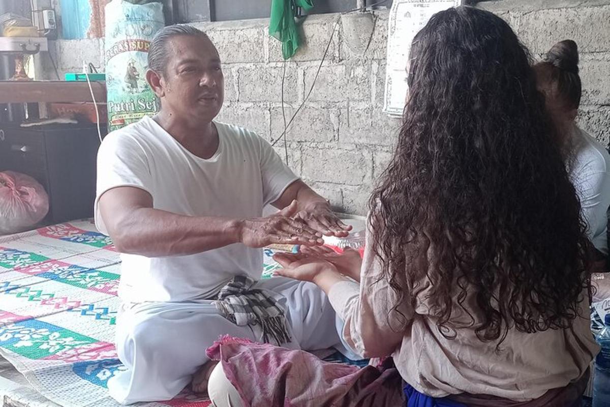 a man and a woman sitting on the floor eating food