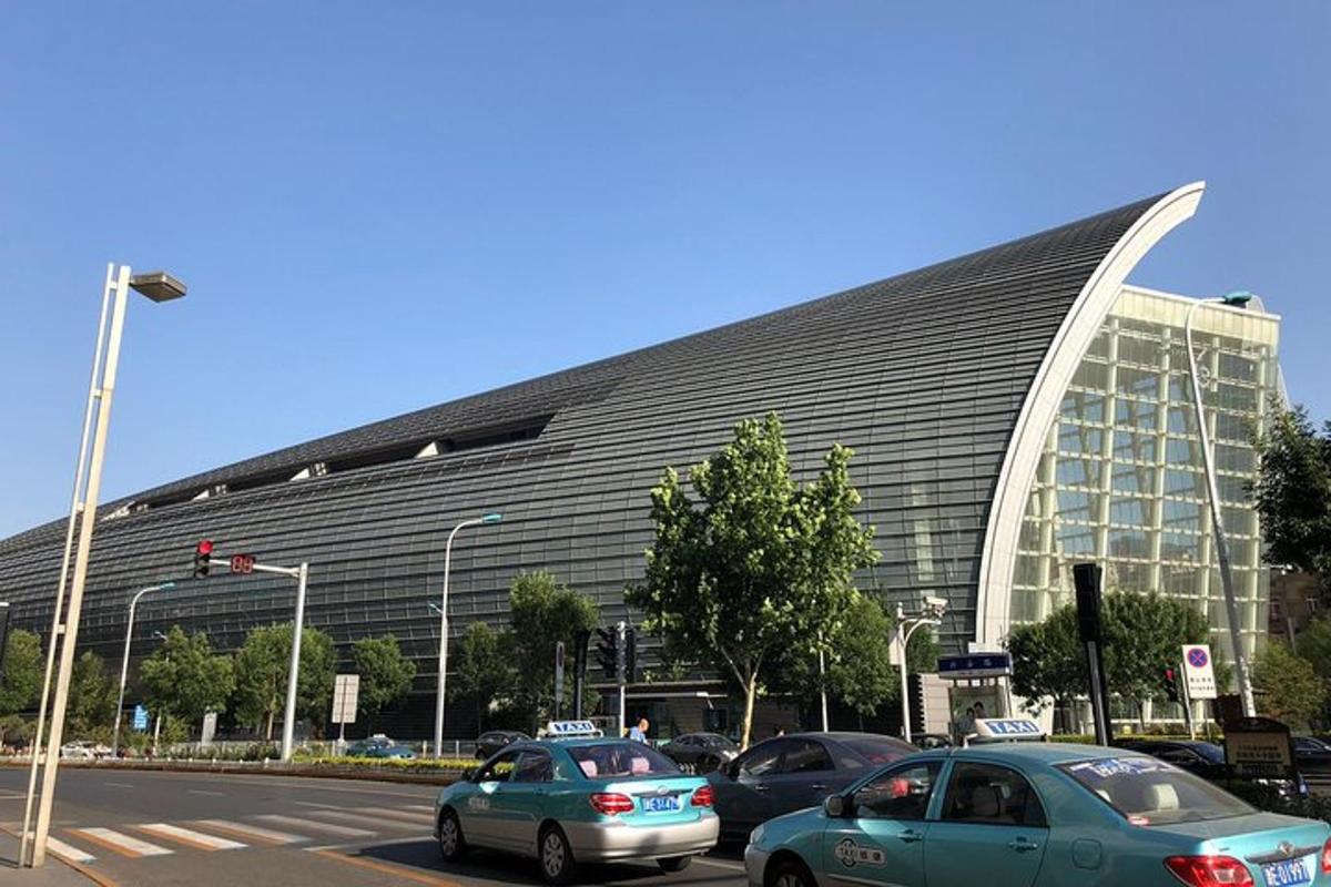 a large building with cars parked in front of it