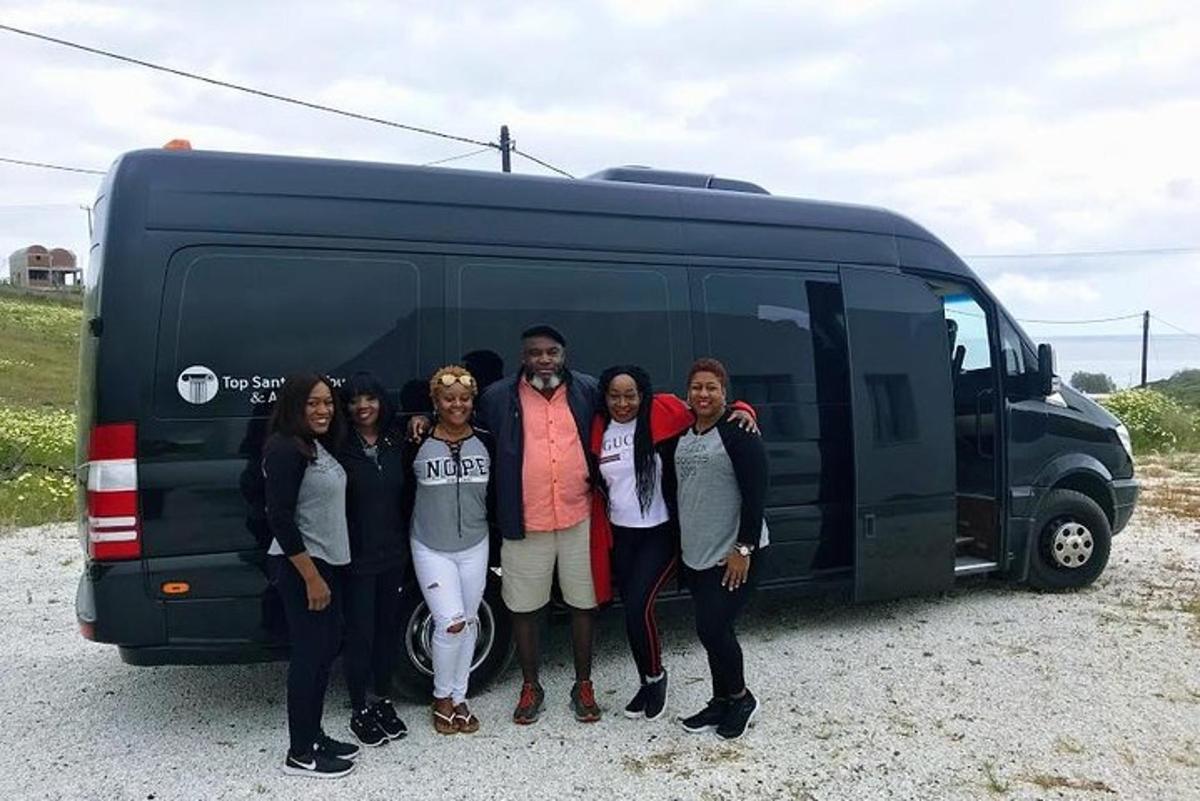 a group of people standing in front of a van