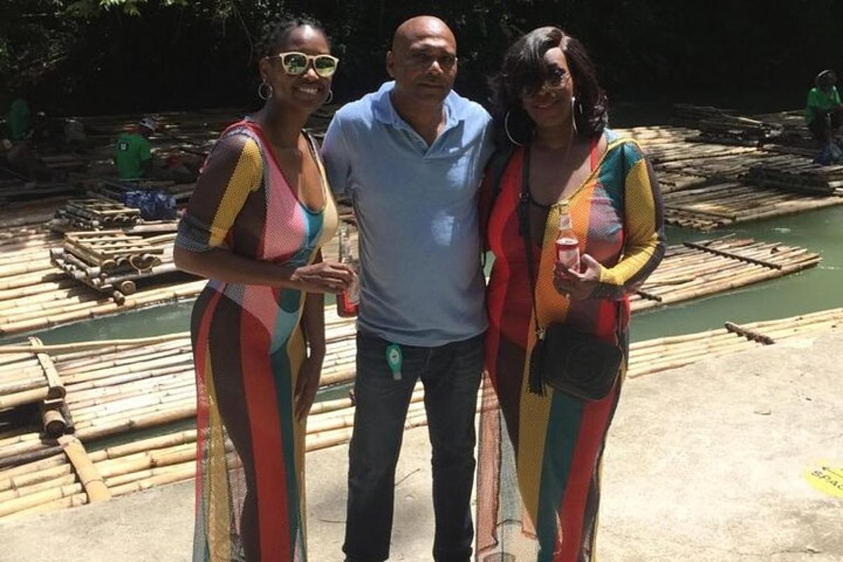 a man and two women standing next to each other