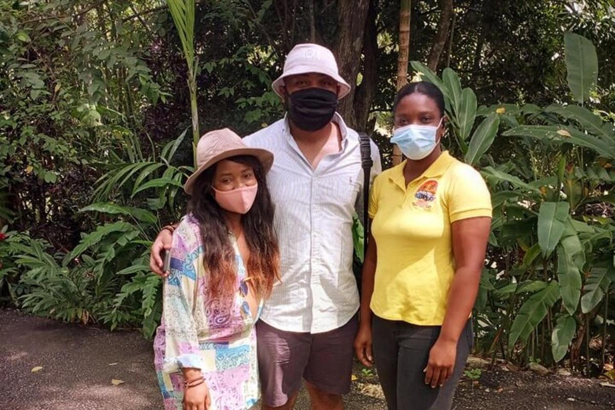 a man and two women wearing face masks