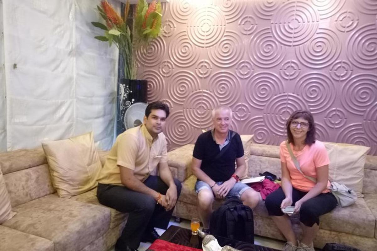 a group of three people sitting on a couch