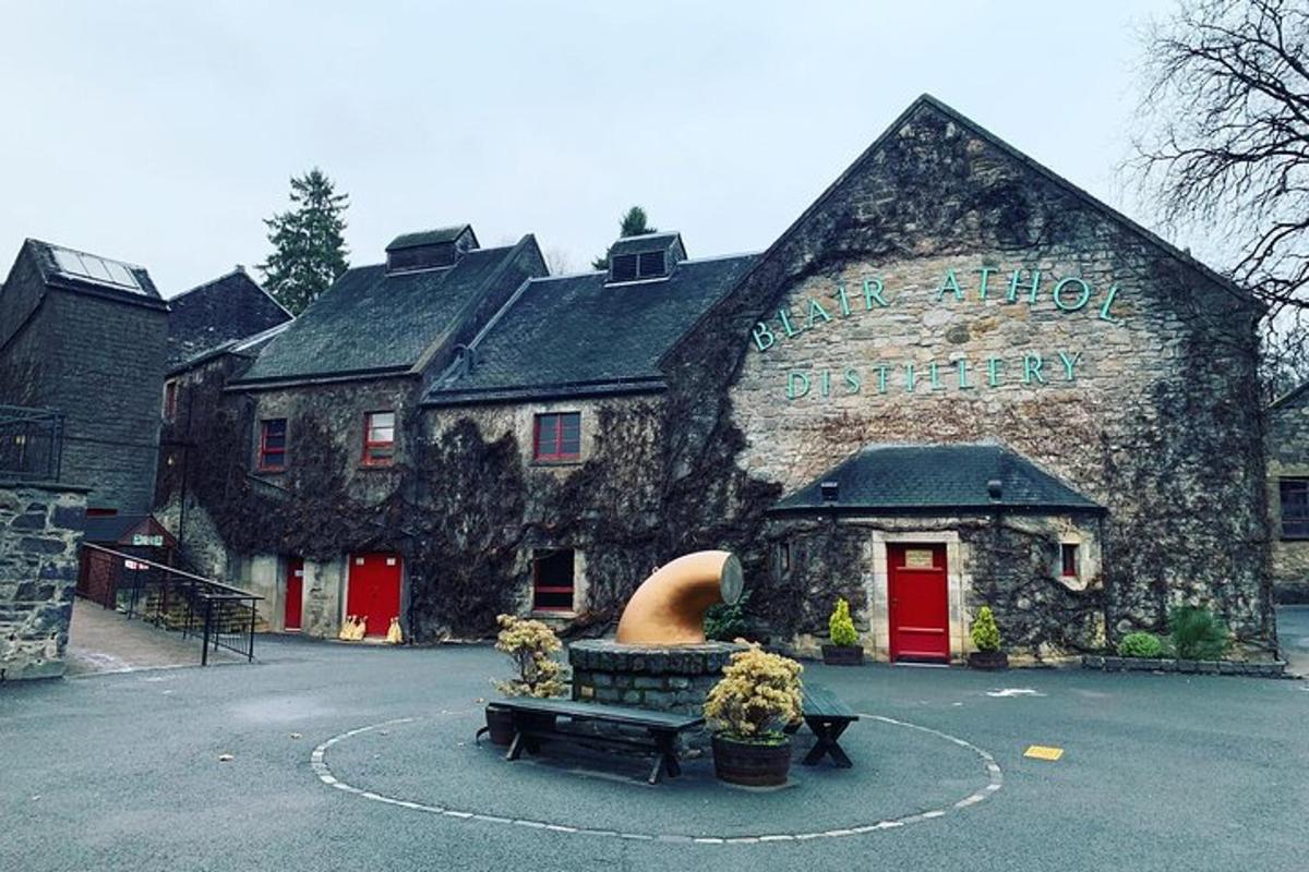 a stone building with a bench in front of it