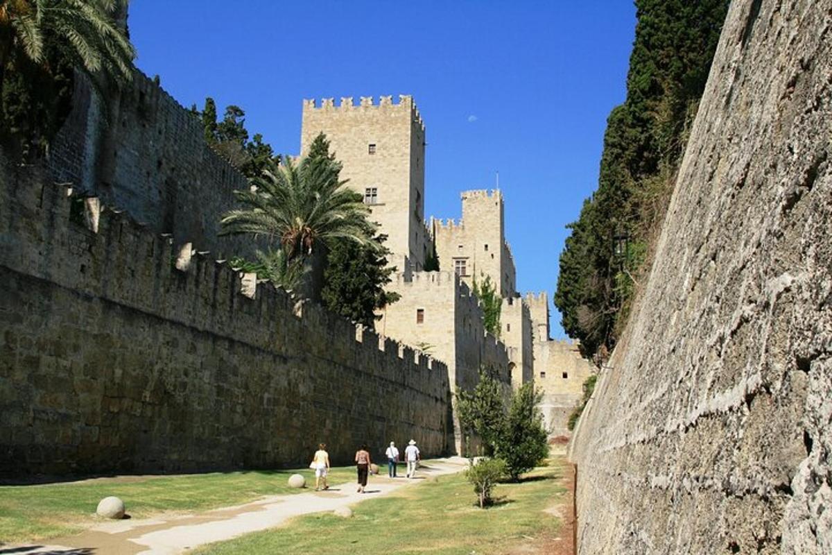 people walking in front of a large castle