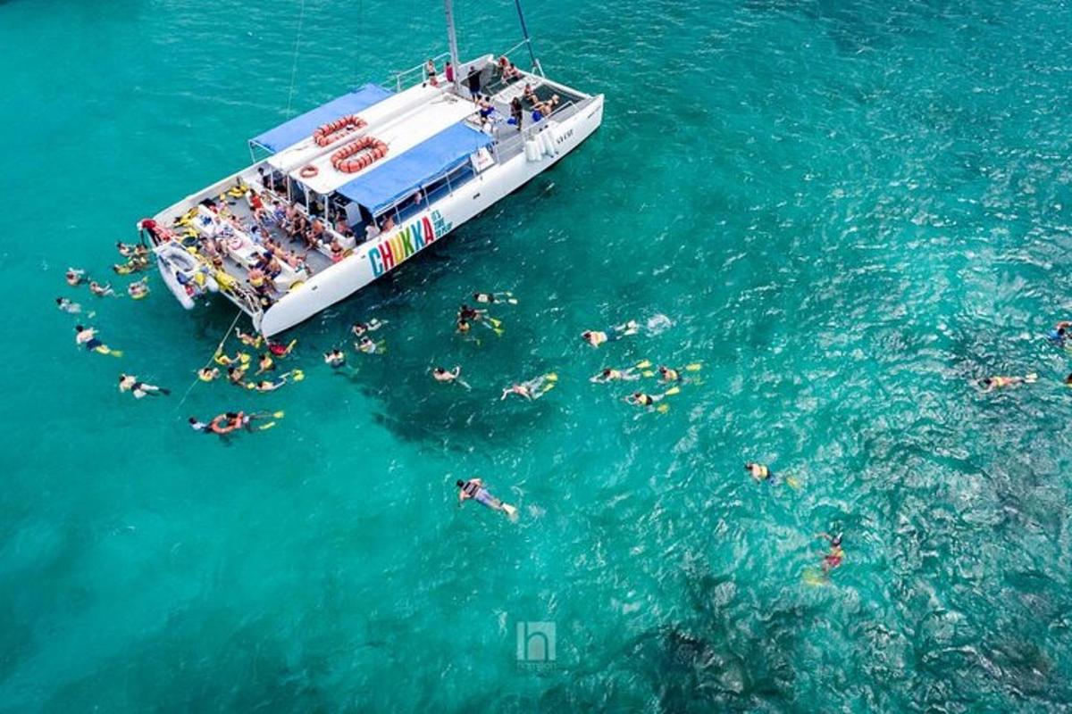 a group of people on a boat in the water