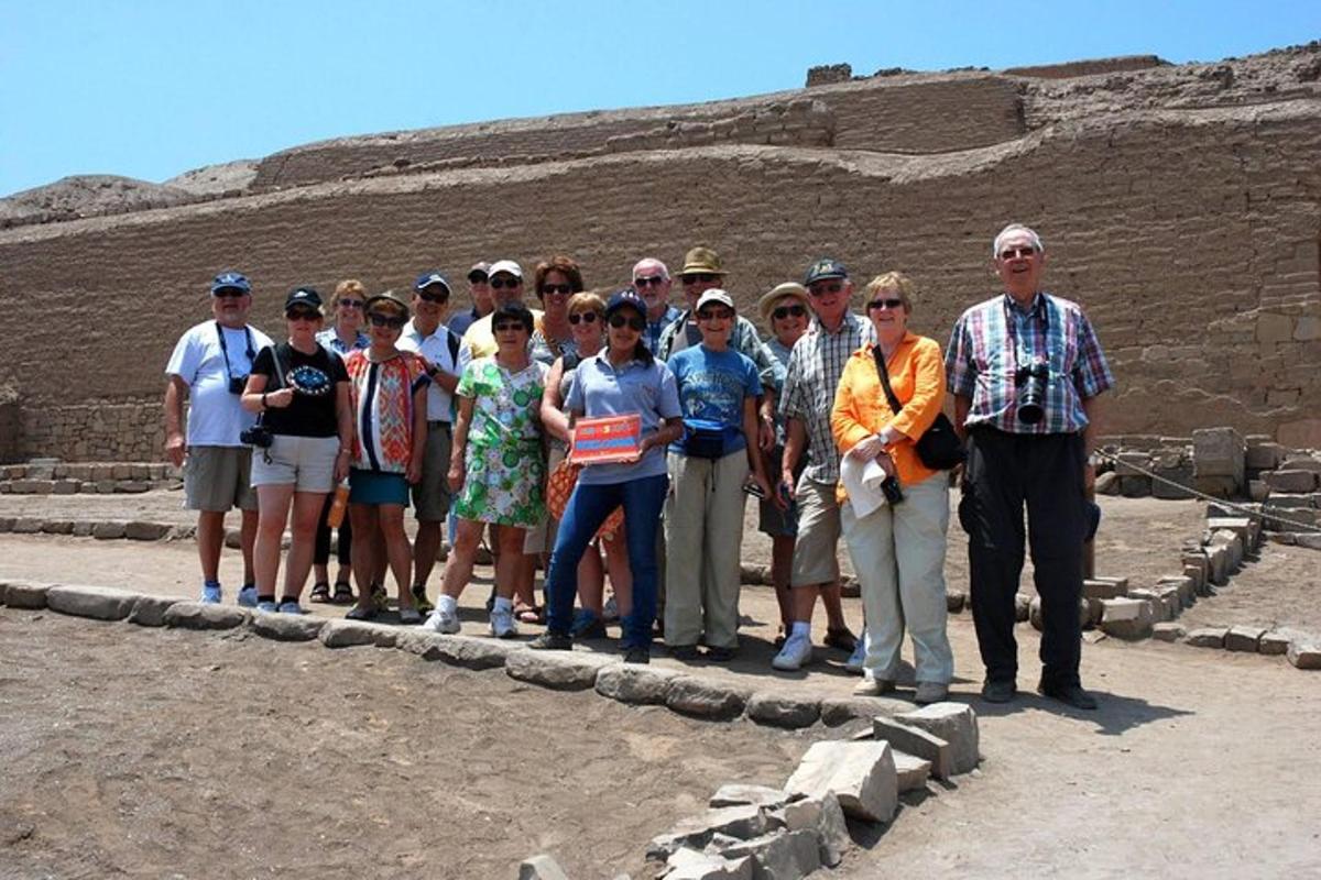 a group of people posing for a picture at the pyramid