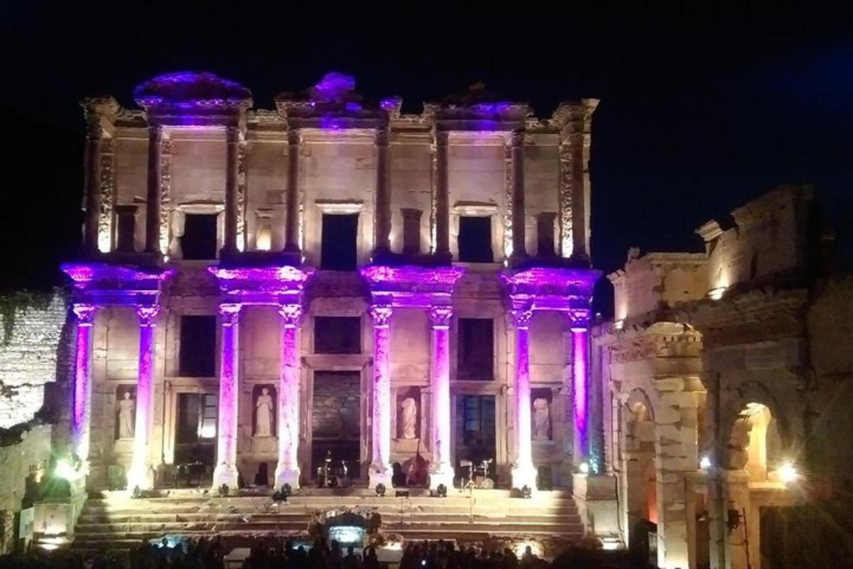 a building with purple lights on it at night