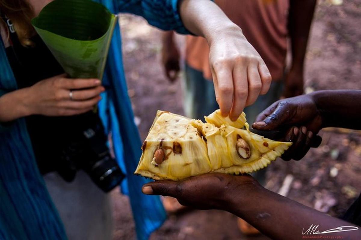 a group of people holding a piece of food