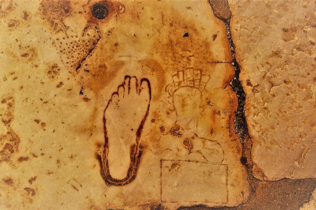 a drawing of a foot on a piece of bread